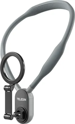A gray neck phone holder with a black magnetic ring and a black clip attachment.