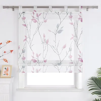 A sheer Roman blind with a branch and leaf pattern is shown hanging in front of a window.