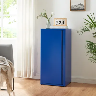 A blue metal cabinet with a sliding door is shown in a room with a chair and curtains.