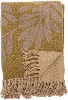 A folded throw blanket with a leaf pattern.