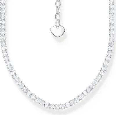 A close-up of a diamond tennis necklace on a white background.
