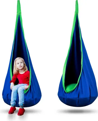 A young girl sits in a blue and green hanging pod chair, with another identical chair shown empty next to it.