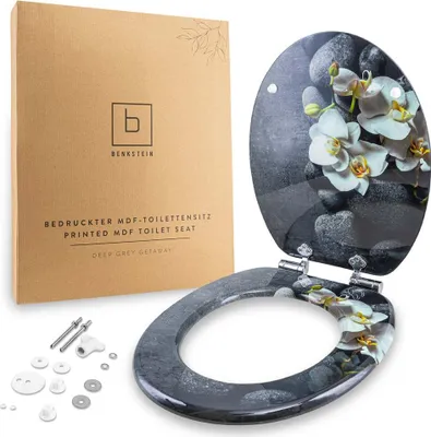 A printed MDF toilet seat with an orchid and stone design, shown with its packaging and installation hardware.