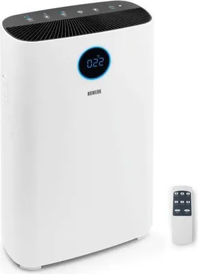 A white air purifier with a digital display and a remote control.