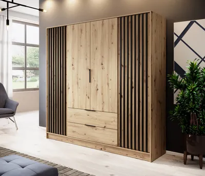 A modern bedroom with a large wooden wardrobe and a chair.