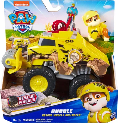 The image shows the packaging of a Paw Patrol Rescue Wheels Rubble toy bulldozer, including the toy itself and a Rubble character figure.