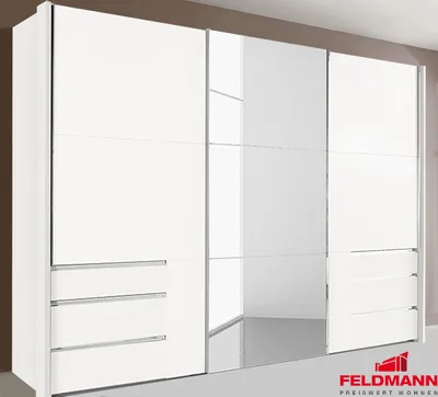 A white wardrobe with mirrored doors in a room.