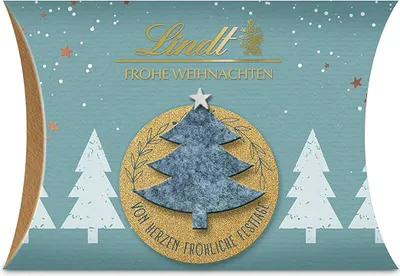 Produktbild von Lindt Pralinés Filz Edition Kissen Klein Assortiert Weihnachten 40g, 40 g, Milchschokolade, Zucker, Kakaobutter, VOLLMILCHPULVER, Kakaomasse, MILCHZUCKER, MAGERMILCHPULVER, Emulgator..., 545 kcal, 2274 kJ, 32 g