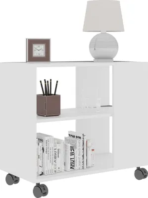 A white rolling side table with a lamp, clock, and books.