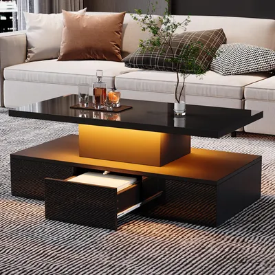 Immagine prodotto di Tavolino da salotto, dimensioni 100 x 50 x 39 cm, realizzato in pannello di particelle al 100%, colore nero, con illuminazione LED controllabile tramite telecomando, superficie lucida, dotato di 1 cassetto