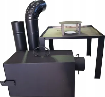 A black metal smoker with a chimney and a table-like structure on top.