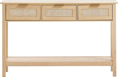 A light wood console table with three drawers featuring rattan inserts and a lower shelf, presented against a white background.