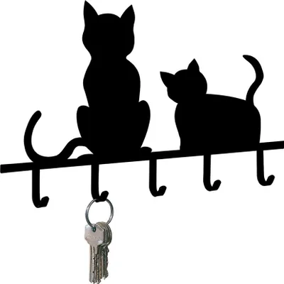 A black silhouette of two cats on a shelf with hooks below.