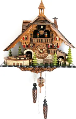 A traditional cuckoo clock with intricate wooden carvings, depicting a house with figures, trees, and animals.