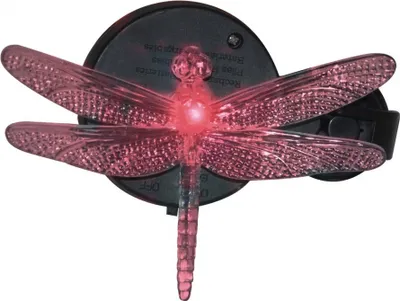 A pink dragonfly-shaped solar light with a suction cup mount.