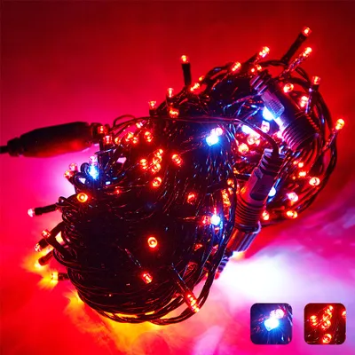A tangled string of red and blue LED lights against a red and pink background.
