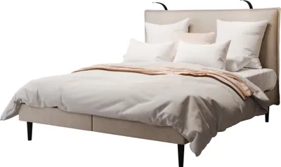 A bed with a beige headboard and bedding, set against a white background.