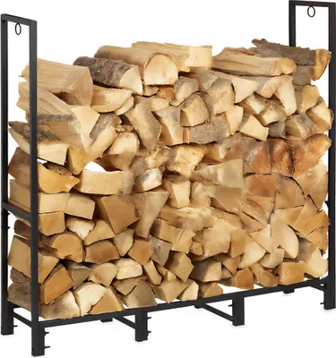A black metal firewood rack filled with logs.