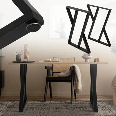 A dining table with black X-shaped legs, a chair with a woven seat, and a rug.