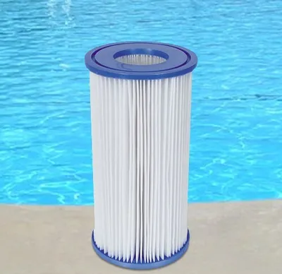 A pool filter is placed on the edge of a swimming pool.