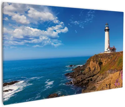 Produktbild von Wallario Premium Leinwandbild Leuchtturm auf einem Felsvorsprung - Blauer Himmel in Größe 60 x 90 cm