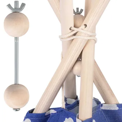 Close-up view of wooden components and fabric of a tipi tent.