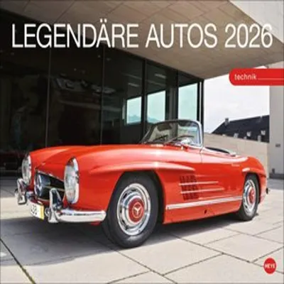 A vintage red convertible car is parked in front of a modern building with large glass windows.