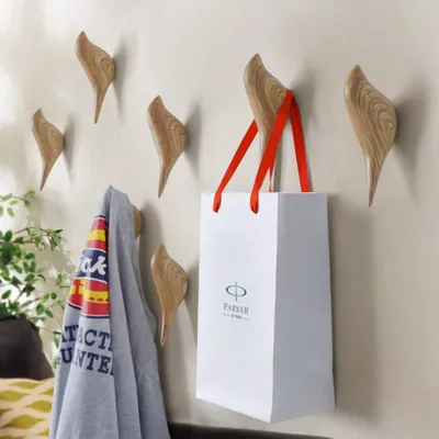 Obrázok produktu pre Nástenný vešiak s motívom vtáka a drevenou vešiačkou