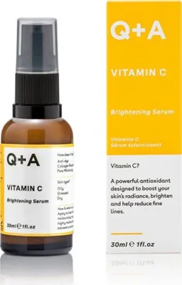A bottle of Q+A Vitamin C Brightening Serum and its packaging are displayed side-by-side against a white background.