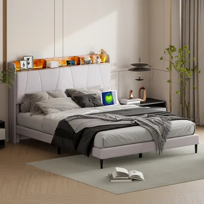 A bedroom scene featuring a bed with a headboard shelf with LED lighting.