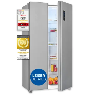 A silver side-by-side refrigerator with its doors open, displaying food items inside. Several award stickers and a circular 'LEISER BETRIEB' (Quiet Operation) badge are affixed to the left door.