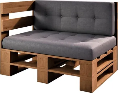 A corner sofa made from wooden pallets with gray cushions.