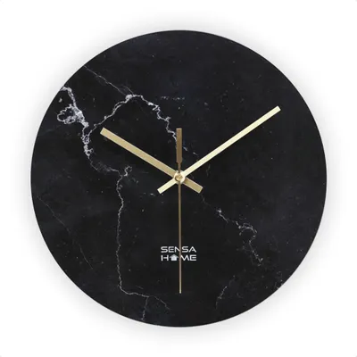 A round wall clock with a black marble design and gold hands.