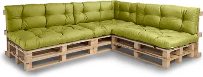A sectional sofa made from wooden pallets with green cushions.
