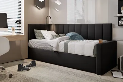 A bedroom scene with a bed, desk, and chair.