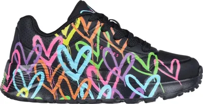 A side view of a black Skechers sneaker with a colorful heart graffiti design.