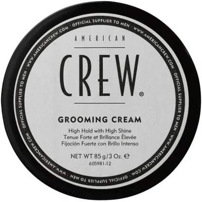 A top-down view of a black and white circular container of American Crew Grooming Cream.