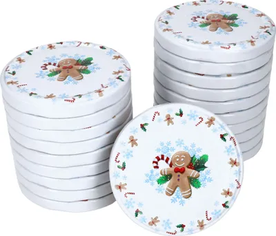 Stacks of round lids with a Christmas gingerbread man design.