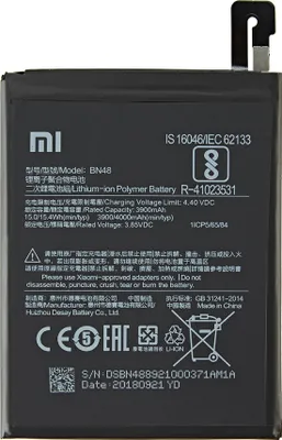 A black smartphone battery with labels and markings.