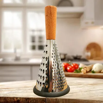Produktbild von Käsehobel aus Edelstahl mit Holzgriff, breit geformt für Käse