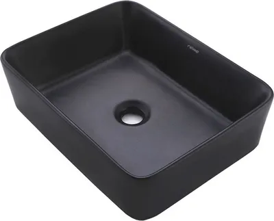 A black rectangular sink basin with a drain hole in the center.