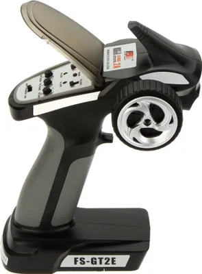 A side view of a black and gray RC car remote control.