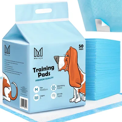 A package of pet training pads with a cartoon dog illustration.