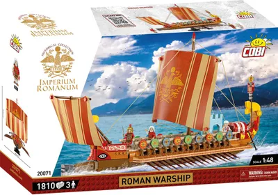 The image shows the packaging of a COBI Roman Warship building block set. The packaging features a dynamic illustration of the assembled model on the water, with mountains and a cloudy sky in the background. Various logos, product details, and branding ele