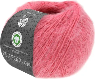 A ball of pink yarn with a label wrapped around it.