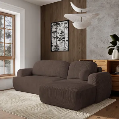 A modern living room with a brown sectional sofa, a rug, and a wooden cabinet.