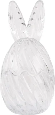 A clear glass Easter egg shaped object with bunny ears on top.