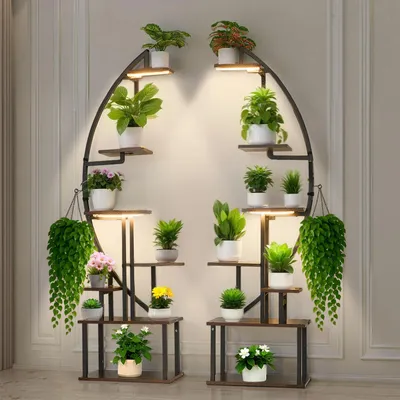 A plant stand with multiple shelves and plants, illuminated by built-in lights, placed against a wall.