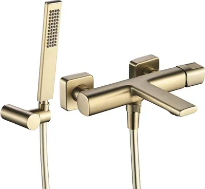 A gold-colored bathroom faucet with a handheld showerhead, shown against a white background.