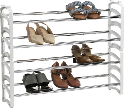 A multi-tiered shoe rack with various types of shoes on each shelf.